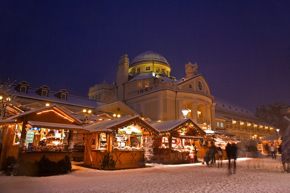 The Merano Christmas market in front of the Kurhaus, under snow